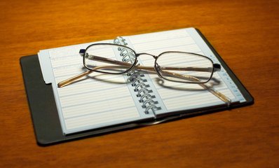 a pair of glasses on a calendar