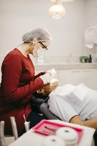 A dentist working in a patient's mouth